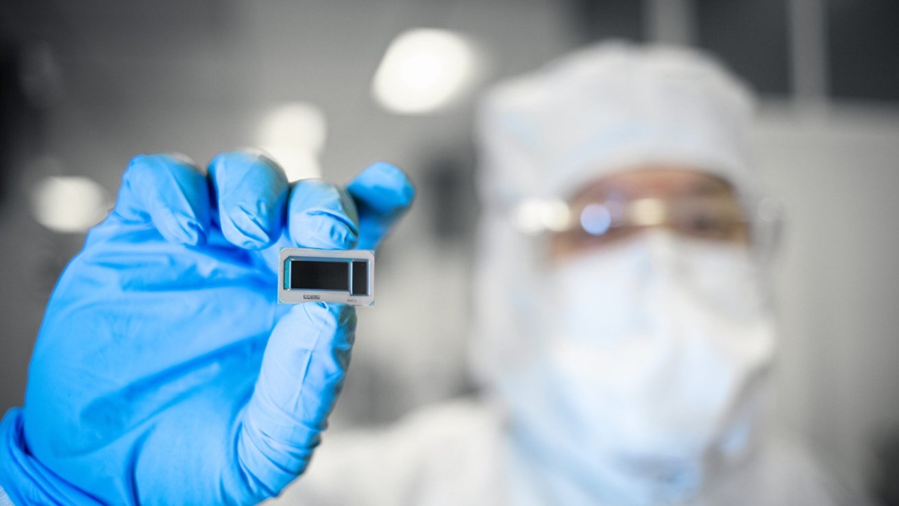 Intel chip worker holding silicon wafer